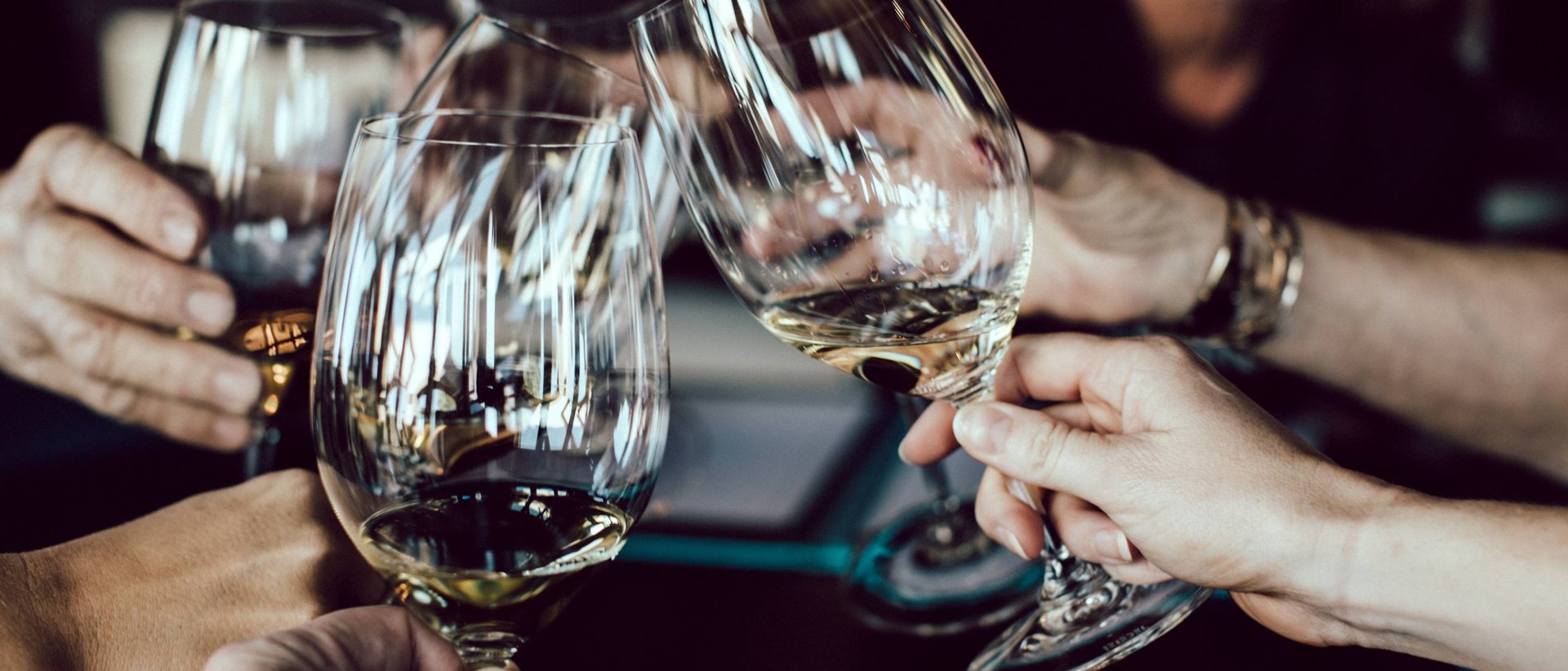 Dorf Tirol: accommodation with style and good food People clinking wine glasses in a social gathering